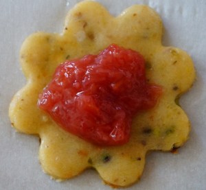 This what the cookie looks like with a dollop of compote. The place another cut out on top and crimp closed. 